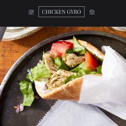 Chicken Meat, Pita Bread, Lettuce, White Sauce and Tomatoes.