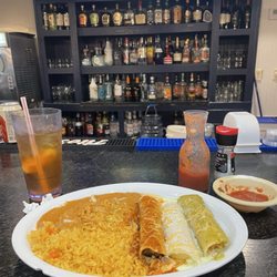 El Tio Jose - My enchiladas with chips and salsa, nice bar too!
