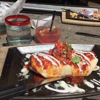 Saint Anejo - Breakfast burrito with sangria in background - Cocktail Bars Near Me - Nashville, Tennessee