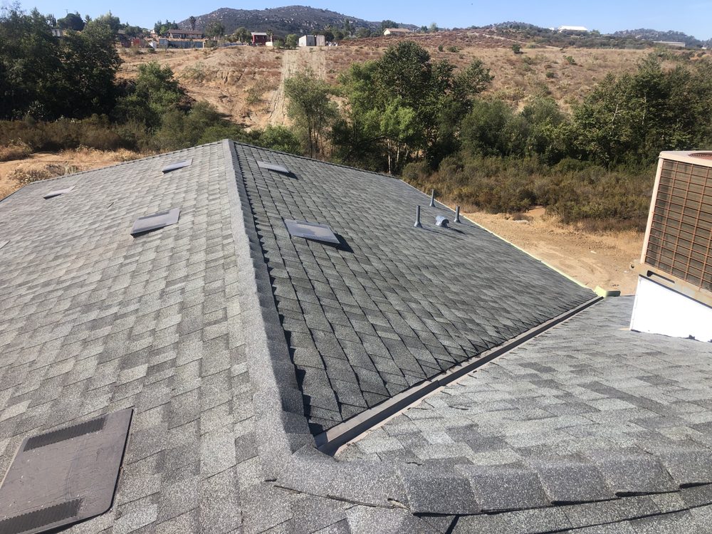 Slide of Escamilla’s Roofing and Rain Gutters