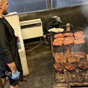 The Freezer Tiki Bar - Steaks cooking on charcoal - Seafood Near Me - Homosassa, Florida