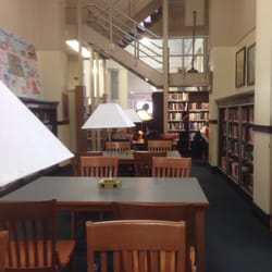 Kearny Public Library - Main hall with 5 large study tables with outlets.