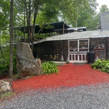 Little Red Schoolhouse - Little Red Schoolhouse from the parking lot, showing the entrance and both the upper and lower screened-in porches - Seafood Near Me - West Campton, New Hampshire Little Red Schoolhouse - Little Red Schoolhouse from the parking lot, showing the entrance and both the upper and lower screened-in porches - Seafood Near Me - West Campton, New Hampshire