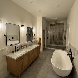 Carmel Stone Imports - Finished master bath. 10' ceilings; inlay in shower and vanity tops from Carmel.