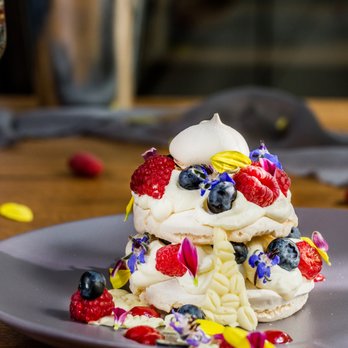 Nota Resto - Pavlova with fruits and currant sauce. - Vegetarian Near Me - Kraków, Massachusetts
