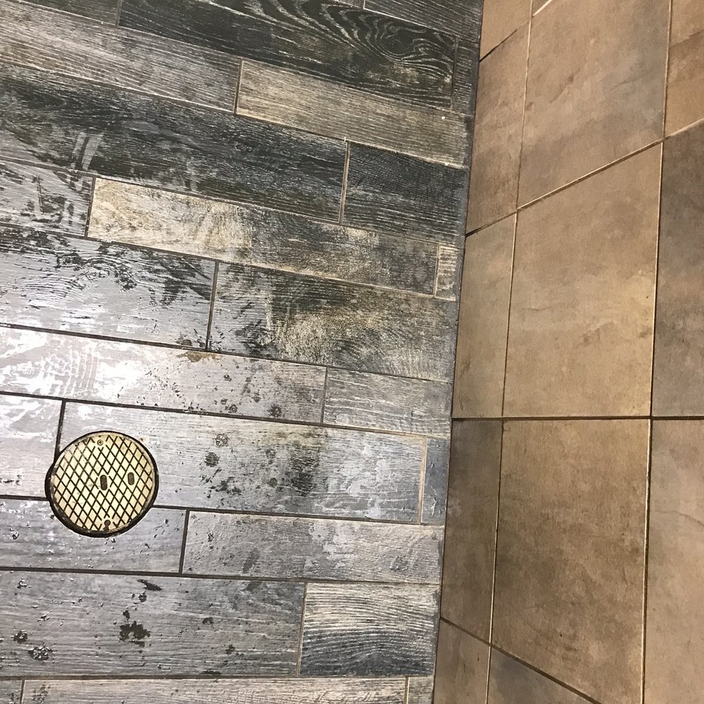 Chaps Pit Beef - Soaking wet floor in the restroom by the empty paper towel dispenser. - Sandwiches Near Me - Aberdeen, Maryland