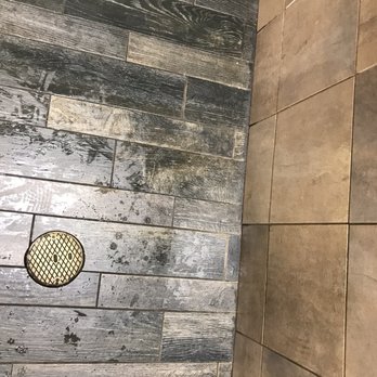Chaps Pit Beef - Soaking wet floor in the restroom by the empty paper towel dispenser. - Sandwiches Near Me - Aberdeen, Maryland