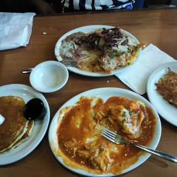 Loaded Cafe - Pictured are the Chilaquiles de Asada and the Chicken Enchilada Omelette. The omelette comes with a side of pancakes. I ordered extra hash. - Breakfast & Brunch Near Me - Santa Ana, California Loaded Cafe - Pictured are the Chilaquiles de Asada and the Chicken Enchilada Omelette. The omelette comes with a side of pancakes. I ordered extra hash. - Breakfast & Brunch Near Me - Santa Ana, California