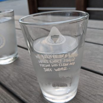 Overflow Taps - a glass of water on a table - Beer Bar Near Me - Lynden, Washington Overflow Taps - a glass of water on a table - Beer Bar Near Me - Lynden, Washington