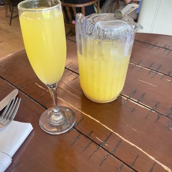 Good Times Kitchen + Bar - Half pitcher mango mimosa $20 - Cocktail Bars Near Me - Houston, Texas