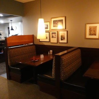 Stagecoach Grille - a restaurant booth with a table and chairs - American Near Me - Atkinson, New Hampshire Stagecoach Grille - a restaurant booth with a table and chairs - American Near Me - Atkinson, New Hampshire