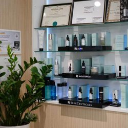 Amee’s Medical Spa - Professional skincare products used and offered at Amee's Medical Spa, displayed alongside treatment certifications in our clinic.