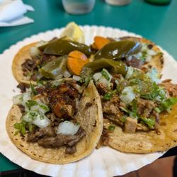 Deliciosos Tacos - 2 carne asada tacos, 2 carnitas tacos, & both delicious!