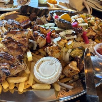 Malek Al Kabob - Partially eaten platter for 4. - Mediterranean Near Me - Dearborn, Michigan Malek Al Kabob - Partially eaten platter for 4. - Mediterranean Near Me - Dearborn, Michigan