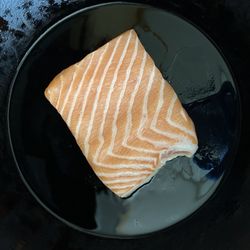 Dry Dock Fish Co - Amazing salmon belly with skin on getting crispy in cast iron! So pretty!