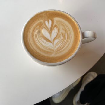 Acola Coffee - latte art in a white cup - Coffee & Tea Near Me - Columbia, Missouri Acola Coffee - latte art in a white cup - Coffee & Tea Near Me - Columbia, Missouri