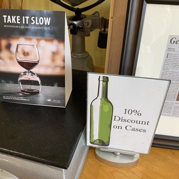Blue Heron Winery - a glass of wine and a sign - Wineries Near Me - Pitt Meadows, British Columbia