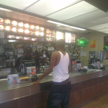 McDonald's - a man standing at the counter - Burgers Near Me - Brighton, Alabama McDonald's - a man standing at the counter - Burgers Near Me - Brighton, Alabama