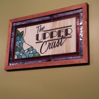 The Upper Crust - a stained glass window above a sign - Pizza Near Me - Beaufort, South Carolina The Upper Crust - a stained glass window above a sign - Pizza Near Me - Beaufort, South Carolina