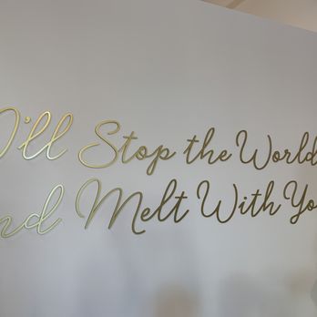 Sweethaven - Cute wall with a bench under for pics! Love the pale pink walls and gold chairs - Ice Cream & Frozen Yogurt Near Me - Franklin, Tennessee