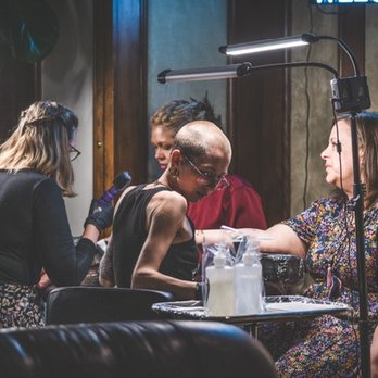 Driftwood Tattoo & Piercing Studio - My sister and a good friend getting their tattoos.  I only wish I had gotten pictures of all the guests! - Tattoo Near Me - Estes Park, Colorado