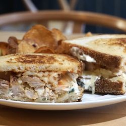 Cellar's Market - Grilled chicken panini served with house-made chips at Cellar's Market.