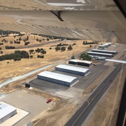 Calaveras County Airport - Hangars looking back after takeoff on runway 31