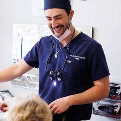 Premier Dental Center - Dr. Spalti finishing an appointment with a patient.