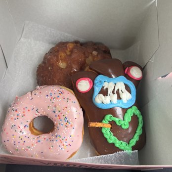 Voodoo Doughnut - Apple Fritter, The Homer, Vegan Voodoo Doll - Donuts Near Me - Houston, Texas Voodoo Doughnut - Apple Fritter, The Homer, Vegan Voodoo Doll - Donuts Near Me - Houston, Texas