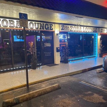 Zoba Lounge - a car parked in front of the restaurant - Hookah Bars Near Me - Pompano Beach, Florida