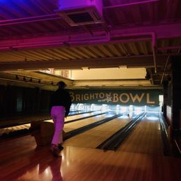 a man standing in a bowling alley