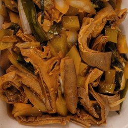 a white takeout container filled with food