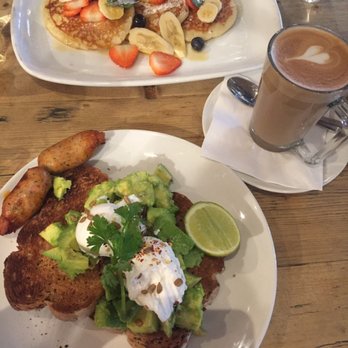 Bill's - Avocado on toast, sausage on side; pancake - Modern European Near Me - London, XGL Bill's - Avocado on toast, sausage on side; pancake - Modern European Near Me - London, XGL