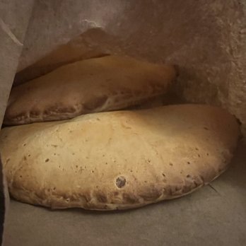 Columbus Bakery - two uncooked pita breads in a paper bag - Bakeries Near Me - North York, Ontario Columbus Bakery - two uncooked pita breads in a paper bag - Bakeries Near Me - North York, Ontario