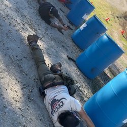 831Shooter - Right Hip, utilizing rain barrel as cover