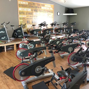 The Seattle Gym - Cycle room with a large screen TV available for Peloton workouts - Gyms Near Me - Seattle, Washington The Seattle Gym - Cycle room with a large screen TV available for Peloton workouts - Gyms Near Me - Seattle, Washington