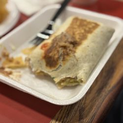 Los Tacos - A half eaten very large burrito
