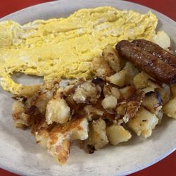 Radcliffe Cafe - Two eggs scrambled, sausage links and home fries $7 and change