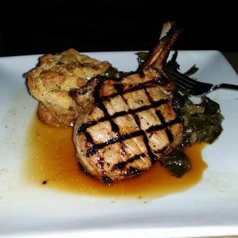 Sprig Restaurant - Pork chop with maple bread pudding and collard greens - Southern Near Me - Decatur, Georgia