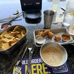 Chips and Queso and Fried Macaroni Balls.