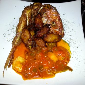 Vejigantes - Chillo Entero Emperrao' Cocido En Mojo Isleño Servido Con Camarones Y Puré De Malanga with Maduros - Puerto Rican Near Me - Boston, Massachusetts Vejigantes - Chillo Entero Emperrao' Cocido En Mojo Isleño Servido Con Camarones Y Puré De Malanga with Maduros - Puerto Rican Near Me - Boston, Massachusetts