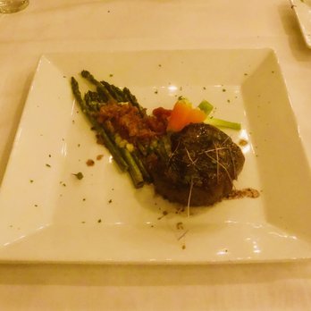 Elizabeth's Chop House - Locally-sourced, grass fed 8 oz tenderloin steak with asparagus and bacon and blue cheese garnish - Steakhouses Near Me - Marquette, Michigan