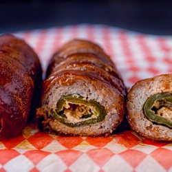 Meat Kandy Food Truck - The Armadillo egg is a jalapeño popper to whole other level wrapped in ground pork and bacon and slow cooked for 2 hours