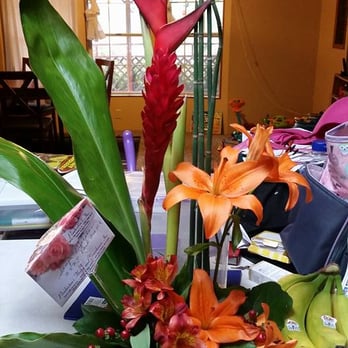 Pemberton's Florist & Gift Shop - This is the floral arrangement as received, photographed when I got home before doing anything to it. Leaning against a box so not to tip. - Florists Near Me - Salem, Oregon