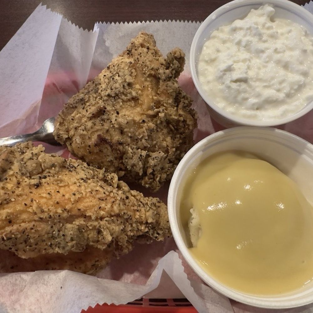 Two-piece fried chicken meal - breast and thigh (my choice). Mashed potatoes and gravy, and cottage cheese. Two-piece fried chicken meal - breast and thigh (my choice). Mashed potatoes and gravy, and cottage cheese.