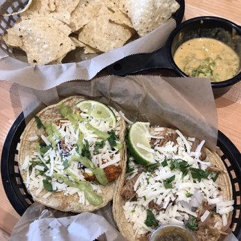 Torchy's Tacos - Mr. Orange, Green chile pork and half order chips and queso - Tex-Mex Near Me - Fort Collins, Colorado Torchy's Tacos - Mr. Orange, Green chile pork and half order chips and queso - Tex-Mex Near Me - Fort Collins, Colorado