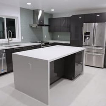 Voitek's Construction - a kitchen with stainless steel appliances - General Contractors Near Me - Ronkonkoma, New York