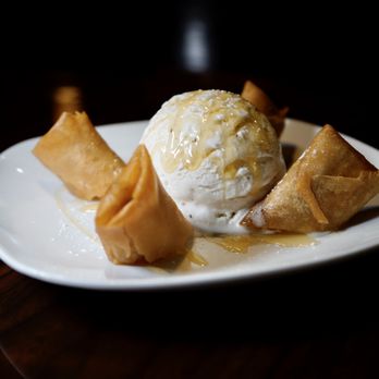 Thai Ghang Waan - Fried Banana & Sticky Rice - wrapped in spring roll, drizzled with honey and served with vanilla ice cream - Thai Near Me - Springfield, Virginia