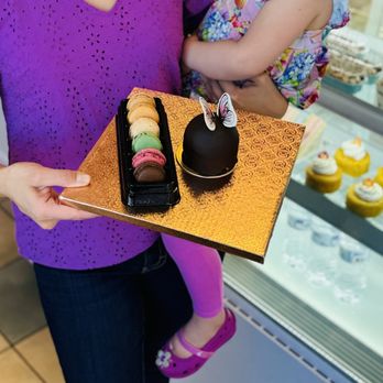 Sy's Sweet Dessert Bar - French macarons and chocolate mousse cake dome with edible butterfly accent - Bakeries Near Me - Las Vegas, Nevada Sy's Sweet Dessert Bar - French macarons and chocolate mousse cake dome with edible butterfly accent - Bakeries Near Me - Las Vegas, Nevada