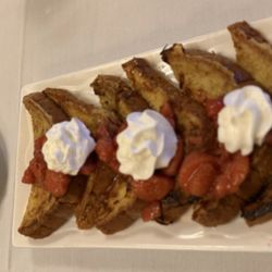 French toast with strawberries and a side of sausage